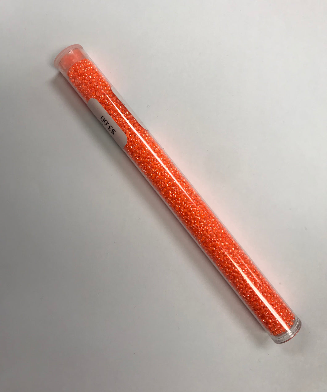 11/0 #205B Orange Fluorescent Lined Crystal